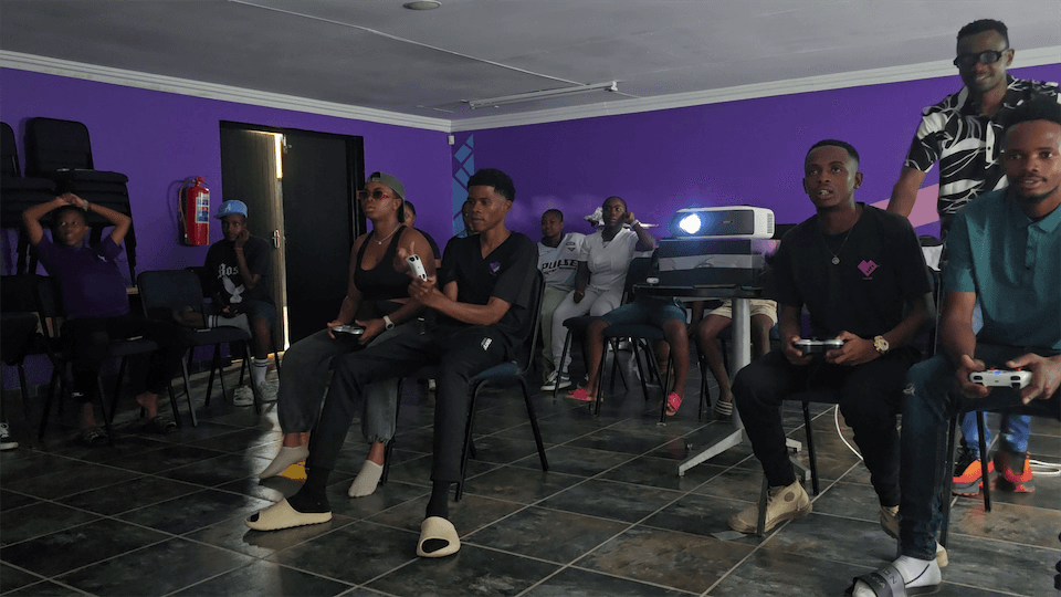 Young people playing Rocket League at a Gamzic event at the loveLife youth centre in eMalahleni