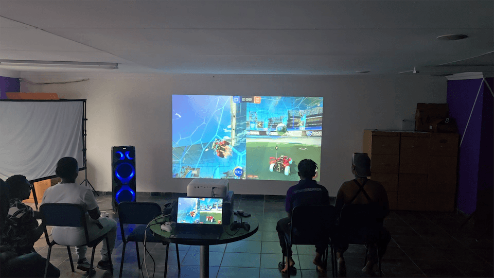 Young people competing in a Gamzic Rocket League match