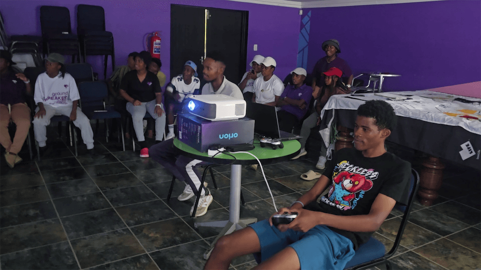 Young people gaming at a Gamzic community event